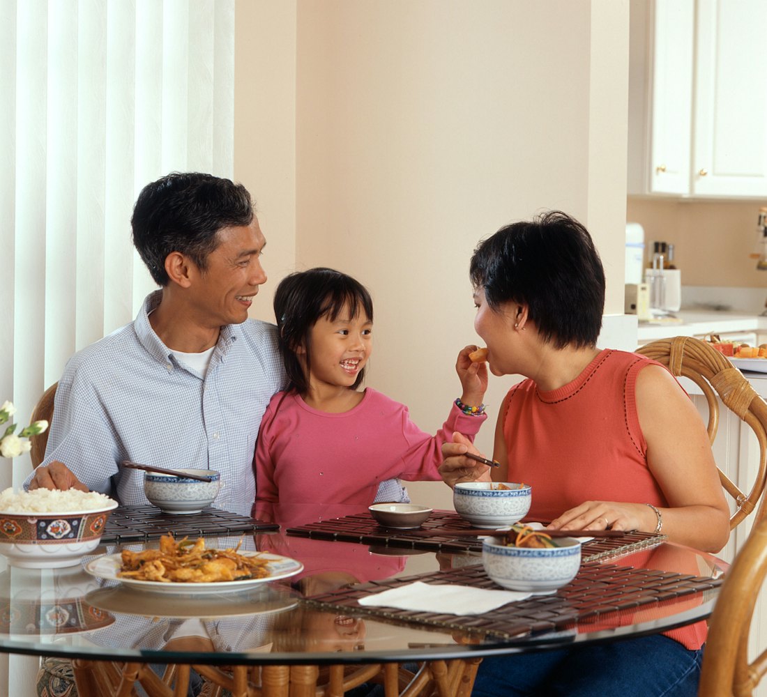 A family sharing a meal at their kitchen table